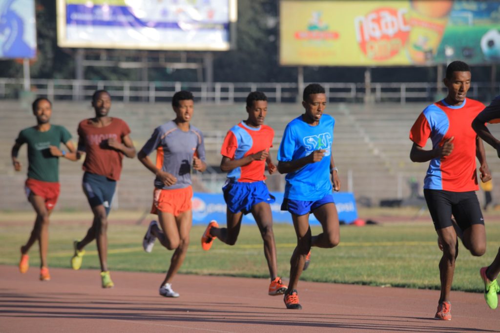 Track runners with good heel lift and arm movement